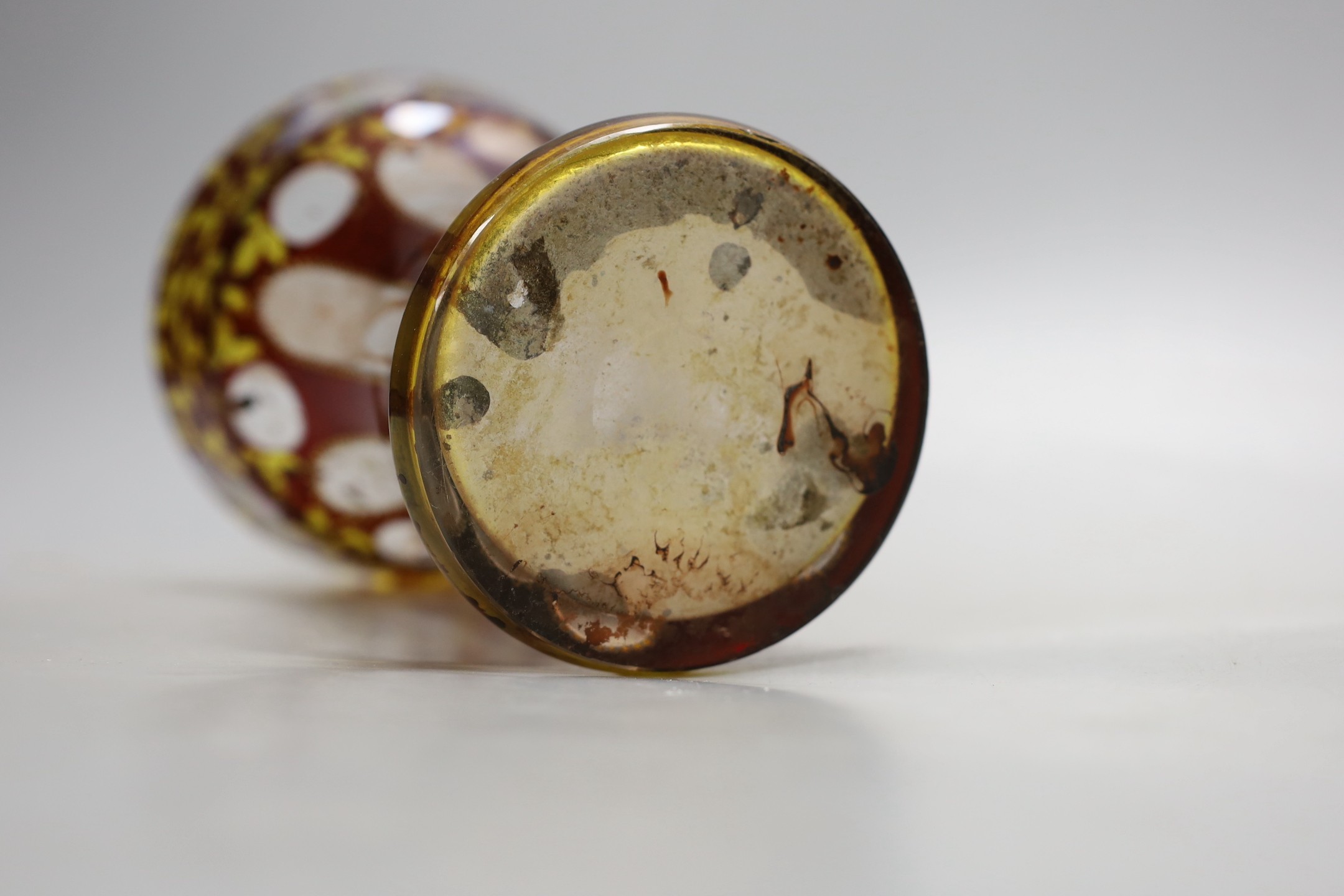 An American? enamelled glass vase and a ruby glass bowl, bowl 23.5 cms diameter.